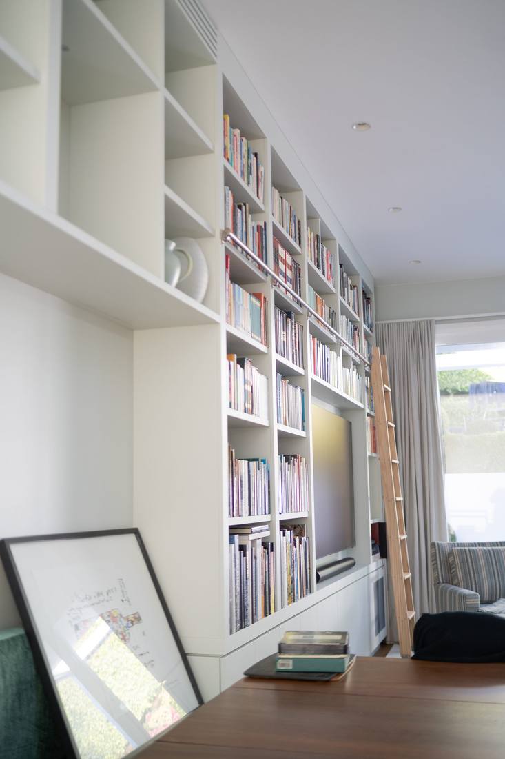 Library shelving with ladder