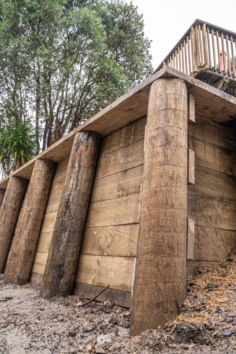 Timber pole retaining wall